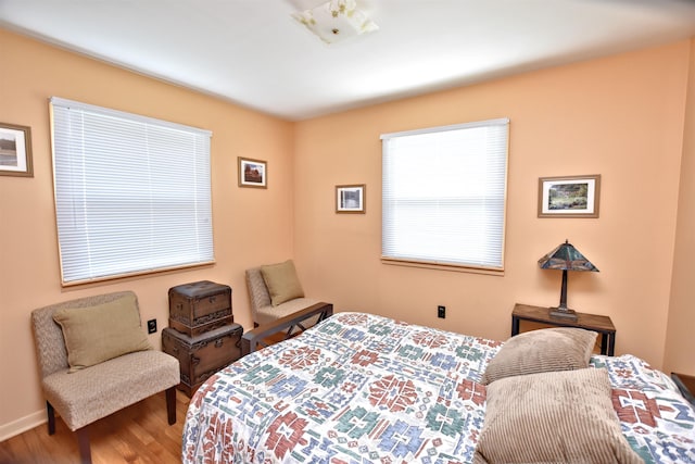 2885 E Bradford Ct, Monon, IN 47959 - bedroom with wood finished floors and baseboards