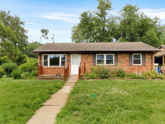1000 N Fairlawn W Cir, Evansville, IN 47711 - view of front of house with brick siding, a front lawn, and roof with shingles