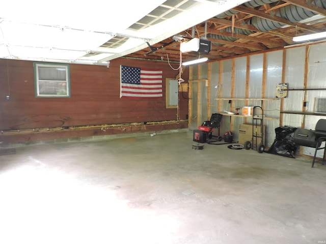 5294 W Finch Rd, Claypool, IN 46510 - garage featuring a garage door opener and electric panel