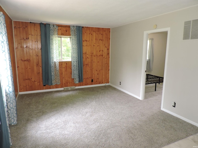 5294 W Finch Rd, Claypool, IN 46510 - carpeted empty room with baseboards and wood walls
