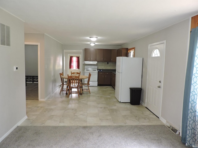5294 W Finch Rd, Claypool, IN 46510 - kitchen with white appliances, plenty of natural light, tasteful backsplash, and light tile patterned flooring