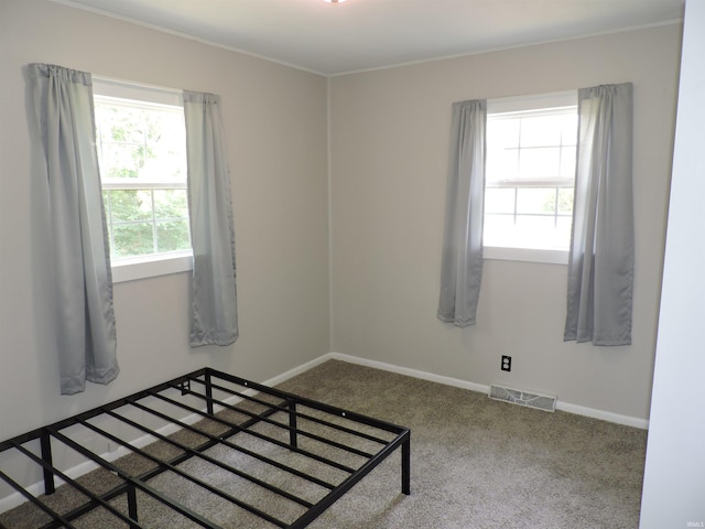 5294 W Finch Rd, Claypool, IN 46510 - unfurnished bedroom with carpet flooring and crown molding
