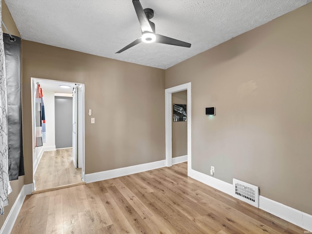 2015 E Blackford Ave, Evansville, IN 47714 - empty room with ceiling fan, a textured ceiling, and light wood finished floors