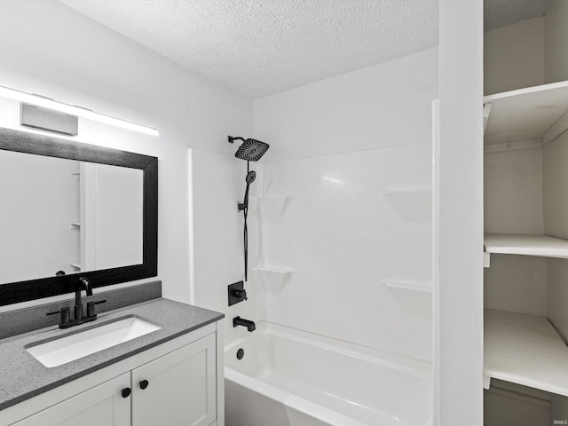 2015 E Blackford Ave, Evansville, IN 47714 - bathroom featuring washtub / shower combination, vanity, and a textured ceiling