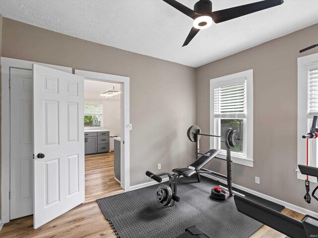 2015 E Blackford Ave, Evansville, IN 47714 - exercise room with ceiling fan, light wood-type flooring, and a textured ceiling
