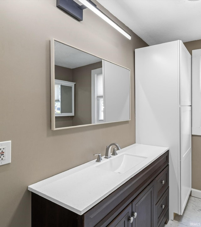 2015 E Blackford Ave, Evansville, IN 47714 - bathroom featuring vanity and marble look tiles