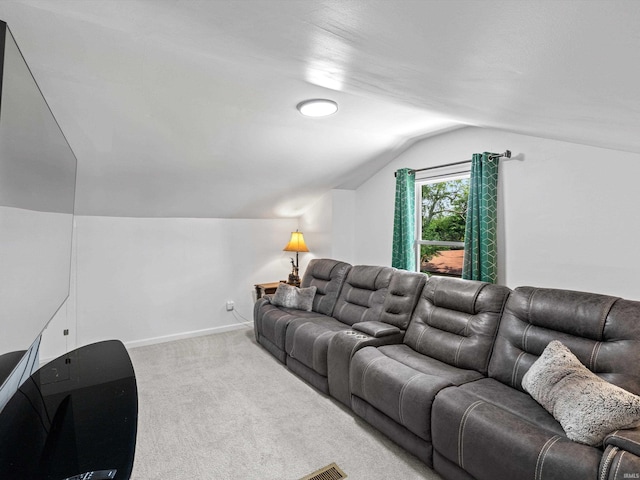 2015 E Blackford Ave, Evansville, IN 47714 - carpeted living area featuring vaulted ceiling and baseboards