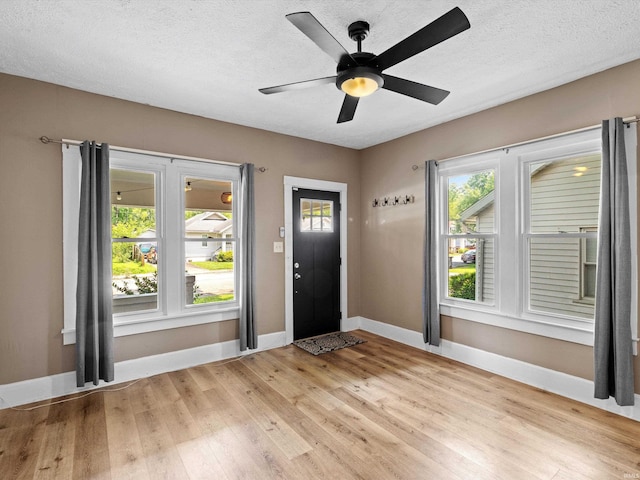 2015 E Blackford Ave, Evansville, IN 47714 - entryway with light wood finished floors, ceiling fan, and a textured ceiling