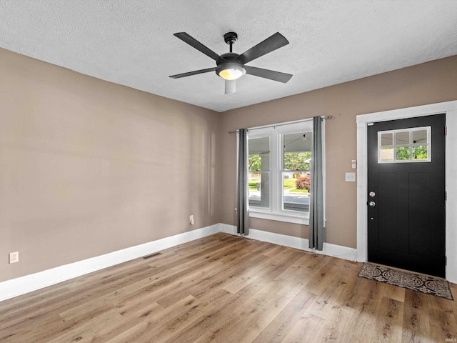 2015 E Blackford Ave, Evansville, IN 47714 - foyer featuring light wood-type flooring, a textured ceiling, and ceiling fan