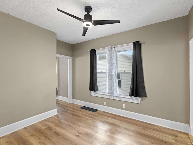 2015 E Blackford Ave, Evansville, IN 47714 - unfurnished room with ceiling fan, light wood-style floors, and a textured ceiling