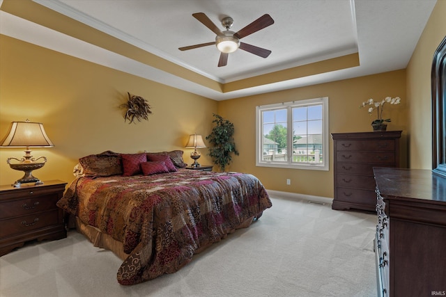 6615 Leeway Dr, South Bend, IN 46628 - bedroom with light carpet, a tray ceiling, ornamental molding, and a ceiling fan