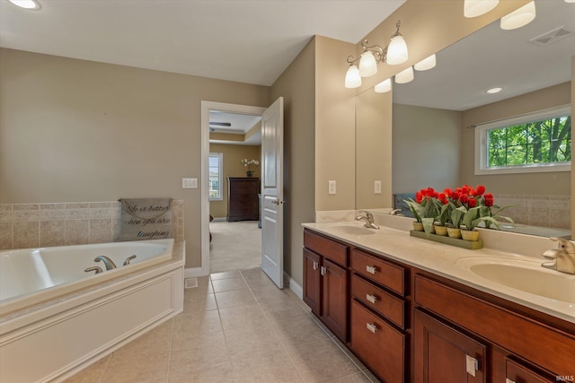6615 Leeway Dr, South Bend, IN 46628 - full bath with double vanity, tile patterned floors, and a garden tub