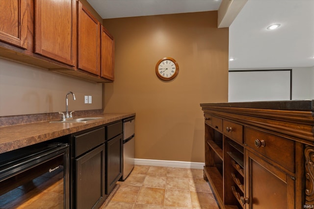 6615 Leeway Dr, South Bend, IN 46628 - kitchen with beverage cooler, dark countertops, refrigerator, and brown cabinetry