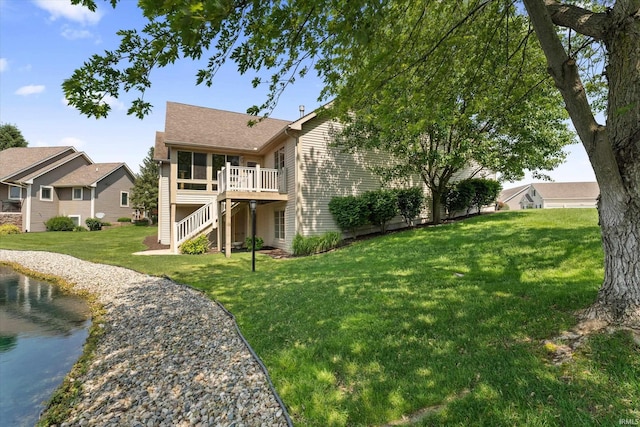 6615 Leeway Dr, South Bend, IN 46628 - back of property with stairs, a sunroom, a yard, and a wooden deck
