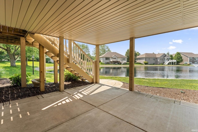 6615 Leeway Dr, South Bend, IN 46628 - view of patio / terrace with a water view, stairs, and a residential view