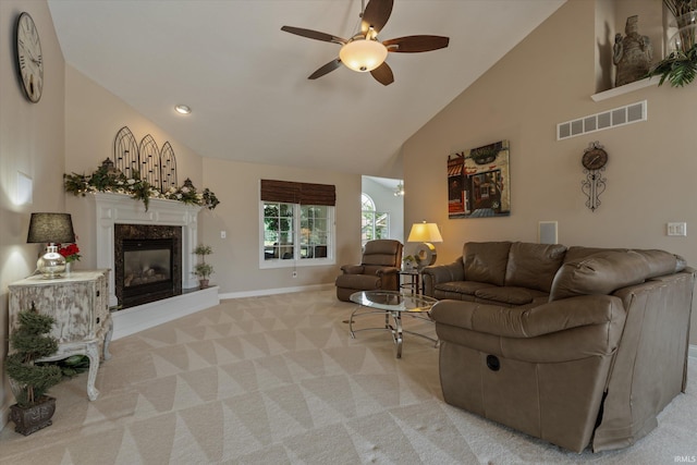 6615 Leeway Dr, South Bend, IN 46628 - living area featuring ceiling fan, light colored carpet, high vaulted ceiling, and a high end fireplace