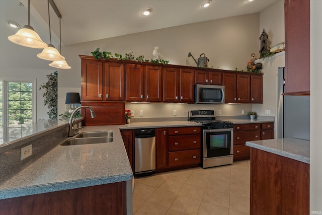 6615 Leeway Dr, South Bend, IN 46628 - kitchen featuring stainless steel appliances, a peninsula, hanging light fixtures, light tile patterned floors, and high vaulted ceiling