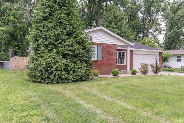 4525 W Middle Ct, Bloomington, IN 47403 - ranch-style house with brick siding, a garage, and concrete driveway