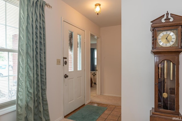 4525 W Middle Ct, Bloomington, IN 47403 - foyer featuring light colored carpet and light tile patterned flooring