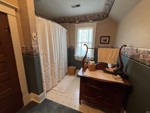 7614 N 100 W Rd, Uniondale, IN 46791 - full bathroom with wallpapered walls, tile patterned floors, vanity, wainscoting, and a shower with curtain