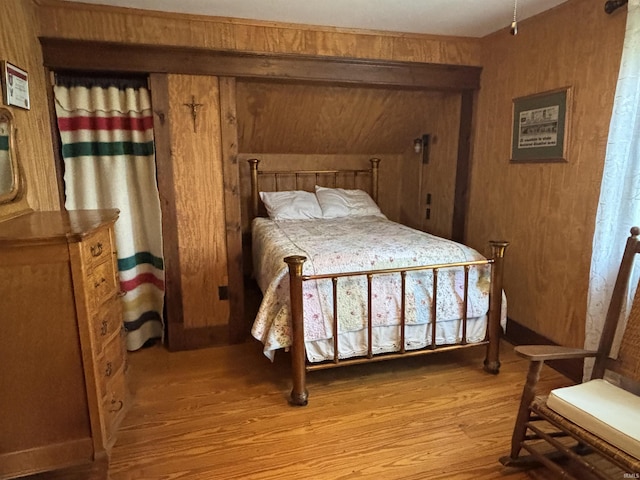 7614 N 100 W Rd, Uniondale, IN 46791 - bedroom with light wood-type flooring and wooden walls