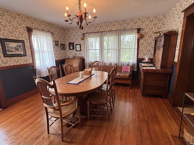 7614 N 100 W Rd, Uniondale, IN 46791 - dining space featuring wallpapered walls, wainscoting, hardwood / wood-style floors, plenty of natural light, and a chandelier