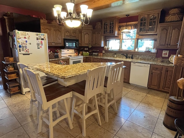 7614 N 100 W Rd, Uniondale, IN 46791 - kitchen featuring white appliances, a chandelier, a kitchen island, glass insert cabinets, and light stone counters