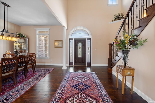 1130 Kingswood Rd, West Lafayette, IN 47906 - entryway featuring plenty of natural light, ornate columns, hardwood / wood-style flooring, and stairs