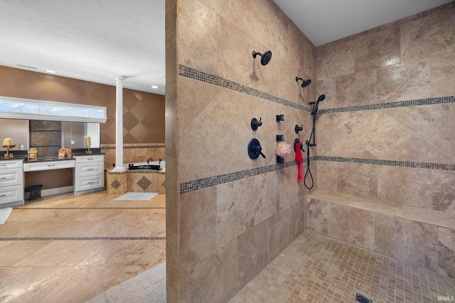 1130 Kingswood Rd, West Lafayette, IN 47906 - bathroom featuring tiled shower, vanity, tile walls, ornate columns, and recessed lighting