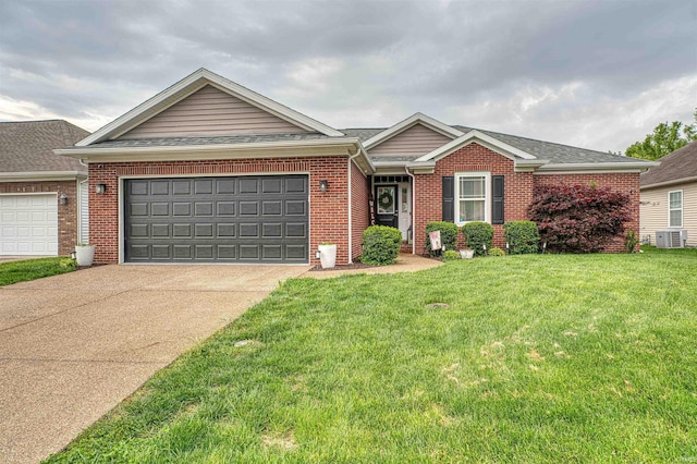 2407 Ellington Ridge Dr, Evansville, IN 47711 - ranch-style home with brick siding, a garage, concrete driveway, and a front lawn