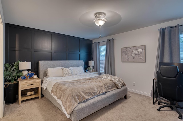 2407 Ellington Ridge Dr, Evansville, IN 47711 - bedroom with light colored carpet, a decorative wall, an office area, and a ceiling fan
