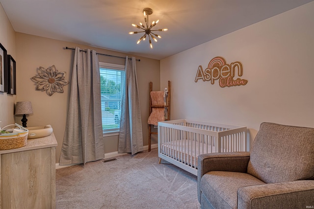 2407 Ellington Ridge Dr, Evansville, IN 47711 - bedroom featuring a chandelier, light carpet, and a crib