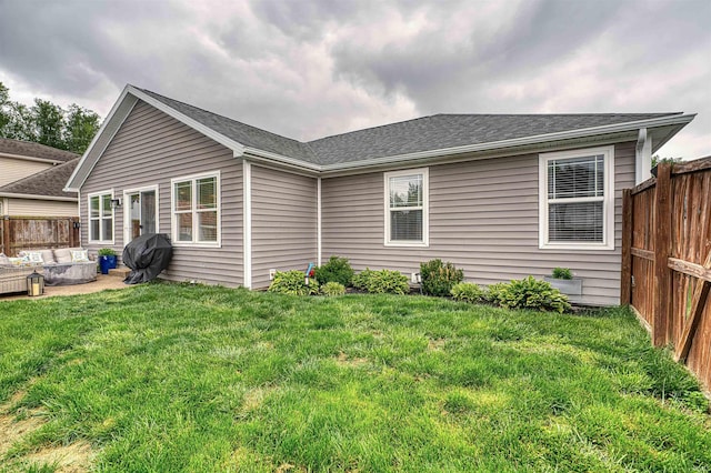 2407 Ellington Ridge Dr, Evansville, IN 47711 - back of property featuring a fenced backyard and a shingled roof