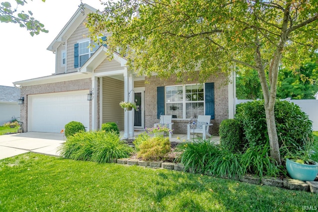 297 Indigo St, Lafayette, IN 47909 - view of front of property featuring brick siding, a garage, a porch, and concrete driveway