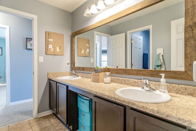 297 Indigo St, Lafayette, IN 47909 - bathroom with double vanity and tile patterned flooring