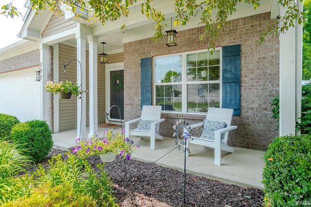297 Indigo St, Lafayette, IN 47909 - covered porch featuring an attached garage