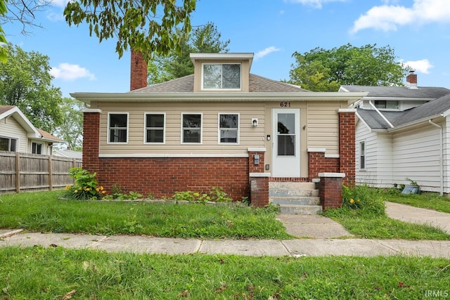 621 S 28th St, Lafayette, IN 47904 - view of front facade with entry steps, brick siding, a chimney, and roof with shingles