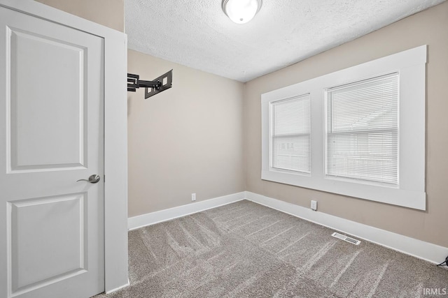 621 S 28th St, Lafayette, IN 47904 - carpeted spare room with a textured ceiling and baseboards