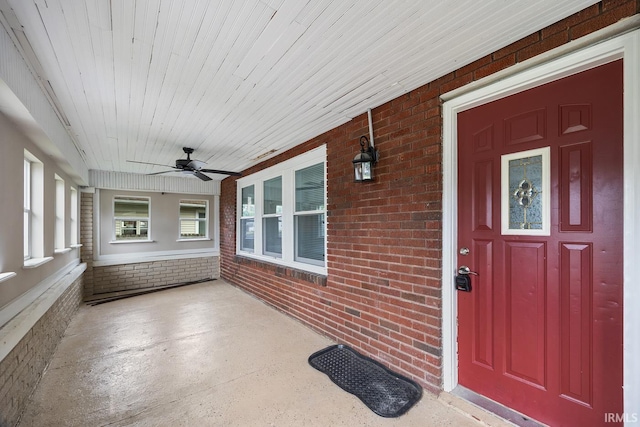 621 S 28th St, Lafayette, IN 47904 - entrance to property with a ceiling fan, a porch, and brick siding
