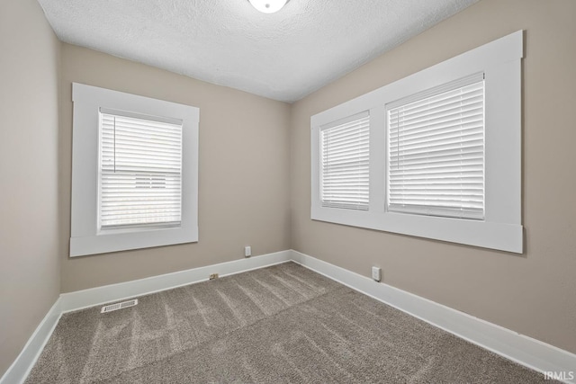 621 S 28th St, Lafayette, IN 47904 - spare room featuring carpet and a textured ceiling