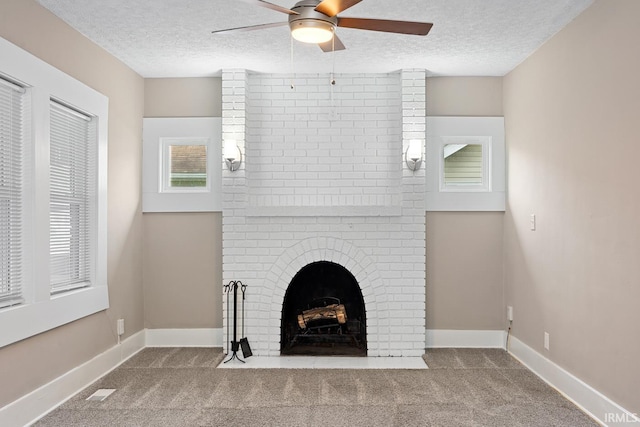 621 S 28th St, Lafayette, IN 47904 - unfurnished living room featuring a textured ceiling, ceiling fan, carpet floors, and a brick fireplace