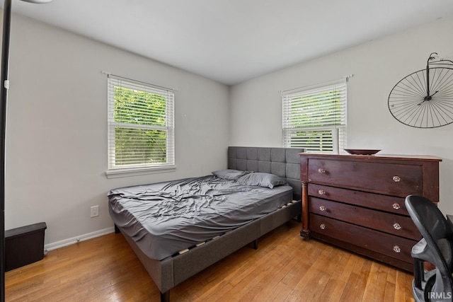 309 Highland Dr, West Lafayette, IN 47906 - bedroom featuring multiple windows and light wood-style flooring