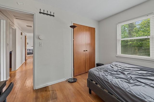 309 Highland Dr, West Lafayette, IN 47906 - bedroom with light wood-type flooring and a closet