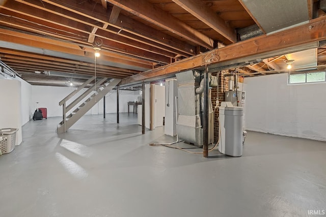 309 Highland Dr, West Lafayette, IN 47906 - basement featuring heating unit, a water softener, and stairway