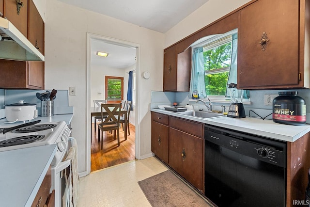 309 Highland Dr, West Lafayette, IN 47906 - kitchen with dishwasher, under cabinet range hood, electric range, light countertops, and healthy amount of natural light