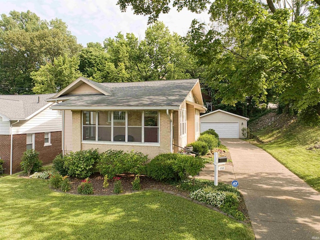 2732 Pennsylvania St, Evansville, IN 47712 - view of front facade with an outdoor structure, brick siding, a detached garage, and a front yard