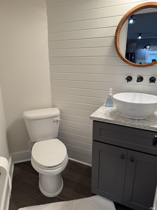 1285 E Zinnia Dr, Bloomington, IN 47401 - bathroom featuring wood finished floors, vanity, and wood walls