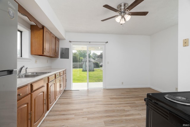115 S 27th St, Lafayette, IN 47904 - kitchen featuring freestanding refrigerator, ceiling fan, light countertops, light wood-type flooring, and electric range