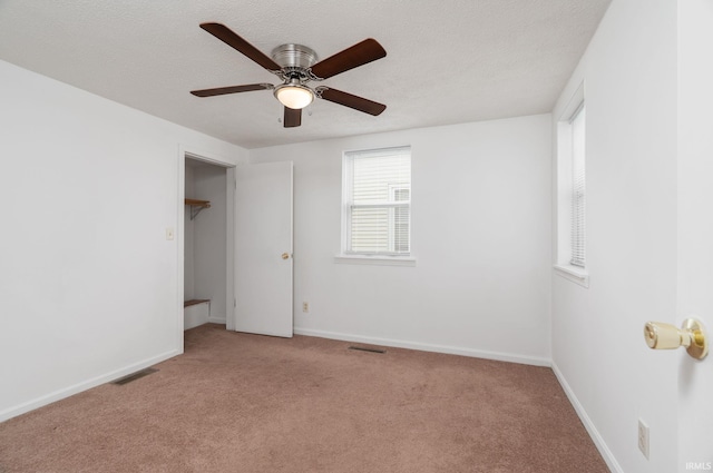 115 S 27th St, Lafayette, IN 47904 - unfurnished bedroom featuring light colored carpet, a ceiling fan, and a textured ceiling