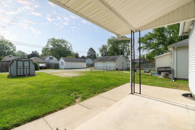 115 S 27th St, Lafayette, IN 47904 - view of yard with a storage shed, a patio, a garage, and a residential view